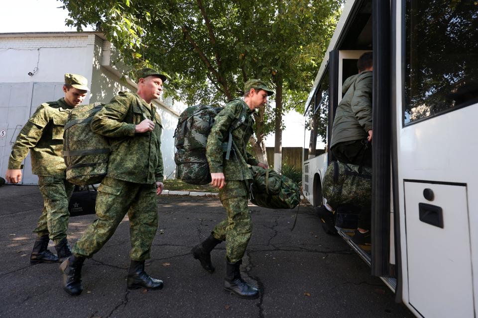 Russian recruits take a bus near a military recruitment center in Krasnodar, Russia, Sunday, Sept. 25, 2022.