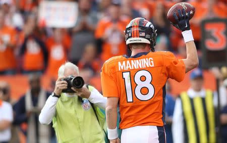 Nov 15, 2015; Denver, CO, USA; Denver Broncos quarterback Peyton Manning (18) acknowledges the crowd after passing the all time passing yard record during the first half against the Kansas City Chiefs at Sports Authority Field at Mile High. Mandatory Credit: Chris Humphreys-USA TODAY Sports