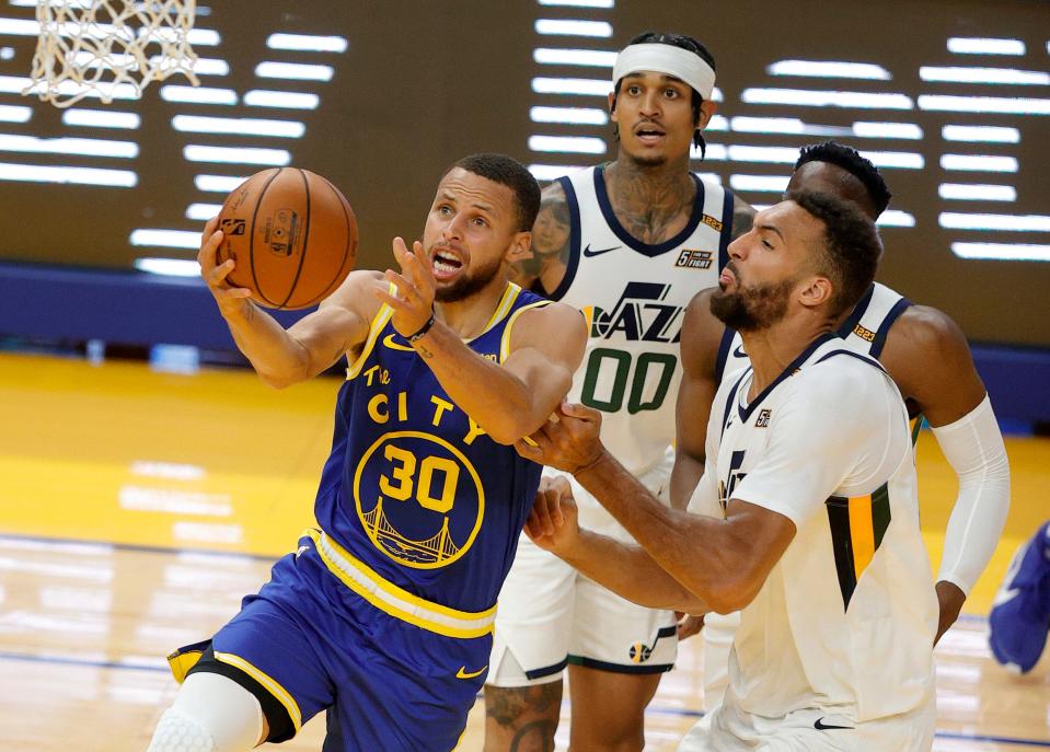 Steph Curry (30) scored 36 points in the Warriors' 119-116 win over the Utah Jazz, clinching a spot for Golden State in the play-in tournament.