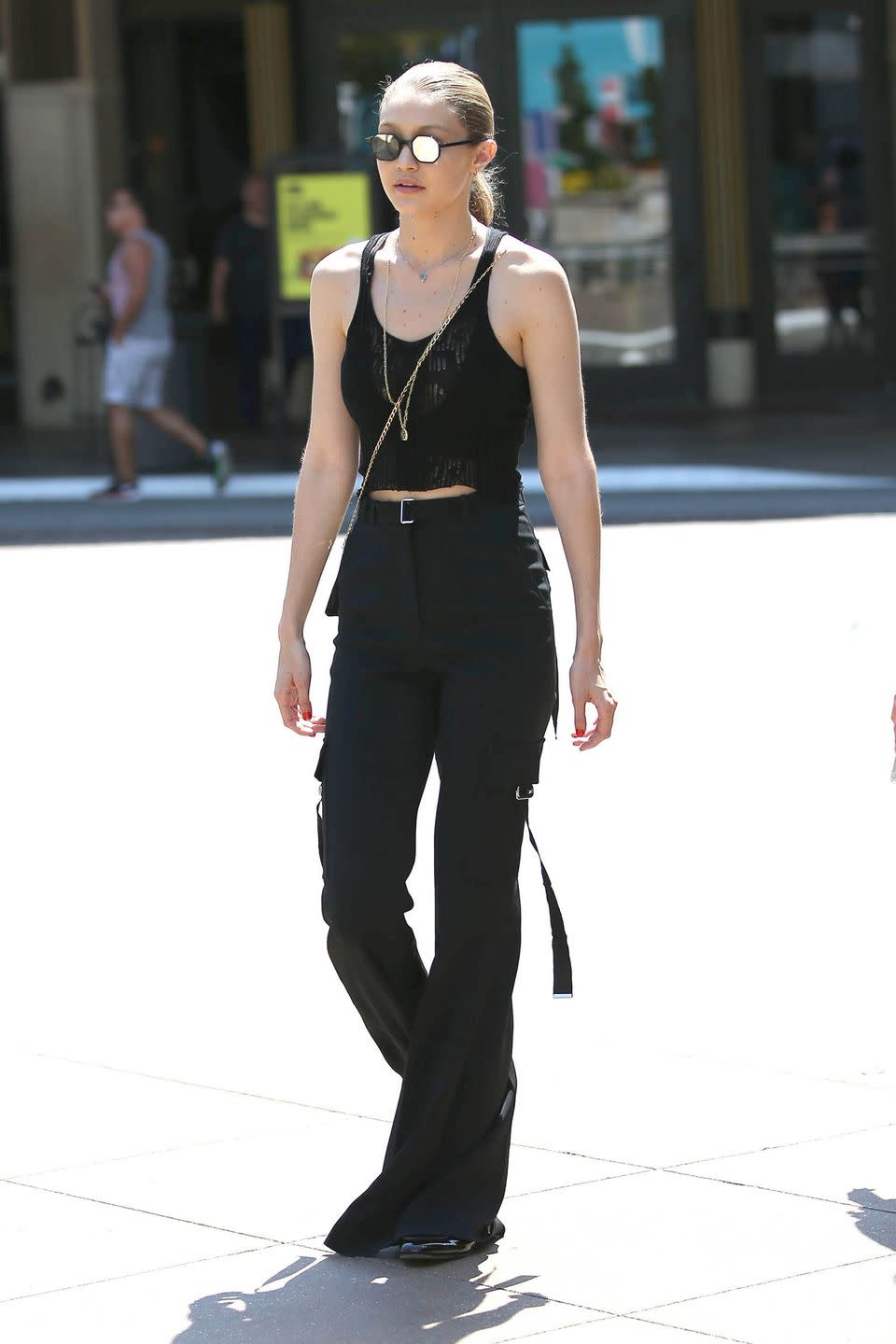 <p>In a mesh crop top, David Koma bellbottoms and Andy Wolf round-mirrored sunglasses while out in LA. </p>