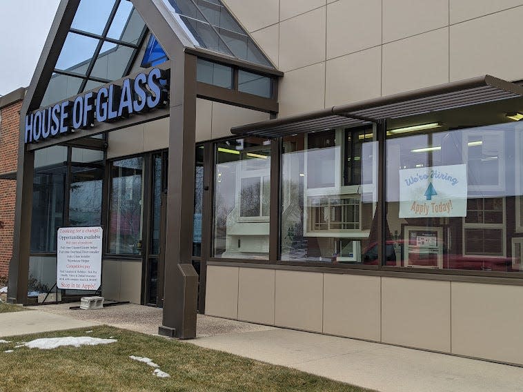 A sign in the window and another near the entrance of House of Glass in Aberdeen remind visitors the business, like many others across the state and nation, is in need of workers.