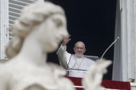 Pope Francis waves to the crowd gathered to attend the Angelus noon prayer he recited from the window of his studio overlooking St. Peter's Square, at the Vatican, Sunday, Jan. 20, 2019. Pope Francis has prayed for peace in Colombia after the Bogota bombing at a police academy. Francis told faithful in St. Peter's Square Sunday that he wanted to assure the Colombian people of his closeness after the "grave terrorist attack" on Jan. 17 that claimed 21 lives. (AP Photo/Andrew Medichini)