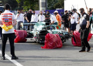 The car of Aston Martin driver Lance Stroll of Canada sits with its wheels wrapped after a crash during the Formula One Grand Prix at the Baku Formula One city circuit in Baku, Azerbaijan, Sunday, June 6, 2021. (Maxim Shemetov, Pool via AP)