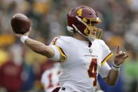 Washington Football Team's Taylor Heinicke throws during the second half of an NFL football game against the Green Bay Packers Sunday, Oct. 24, 2021, in Green Bay, Wis. (AP Photo/Matt Ludtke)