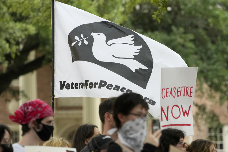 A small group of University of Southern Mississippi students and activists hold Pro-Palestinian signs protesting the Israel-Hamas war in Gaza, during an hour-long silent protest on the school's campus, Tuesday, May 7, 2024, in Hattiesburg, Miss. The 50 demonstrators drew no counter protesters or hecklers. (AP Photo/Rogelio V. Solis)