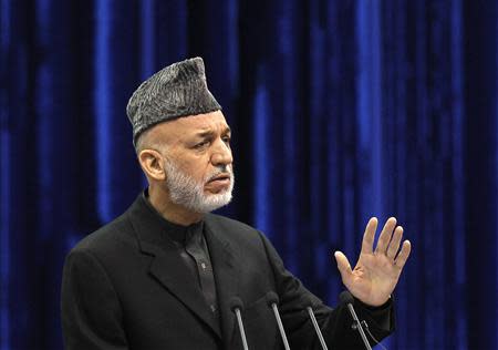 Afghan President Hamid Karzai speaks during the opening of the Loya Jirga, in Kabul November 21, 2013. REUTERS/Omar Sobhani