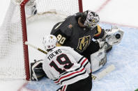 Vegas Golden Knights goalie Robin Lehner (90) makes the save on Chicago Blackhawks' Jonathan Toews (19) during the second period of an NHL hockey Stanley Cup first-round playoff series, Thursday, Aug. 13, 2020, in Edmonton, Alberta. (Jason Franson/The Canadian Press via AP)