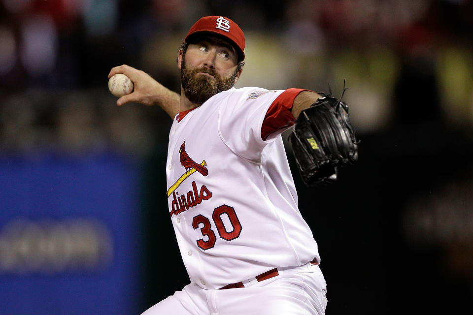 ST LOUIS, MO - OCTOBER 19: Jason Motte #30 of the St. Louis Cardinals pitches in the ninth inning during Game One of the MLB World Series against the Texas Rangers at Busch Stadium on October 19, 2011 in St Louis, Missouri. (Photo by Rob Carr/Getty Images)