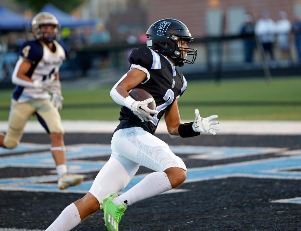 South Bend Saint Joseph senior Hayden Miller runs in his first touchdown of the game against New Prairie Friday, Sept. 15, 2023, at Father Bly Field in South Bend.