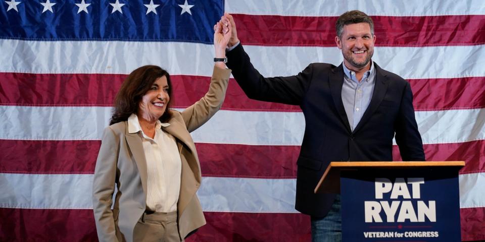 Democratic candidate Pat Ryan, right, and New York Gov. Kathy Hochul appear on stage together during a campaign rally for Ryan, Monday, Aug. 22, 2022, in Kingston