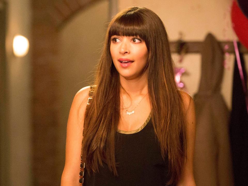 Hannah Simone as Cece in a black shirt looking surprised in the loft