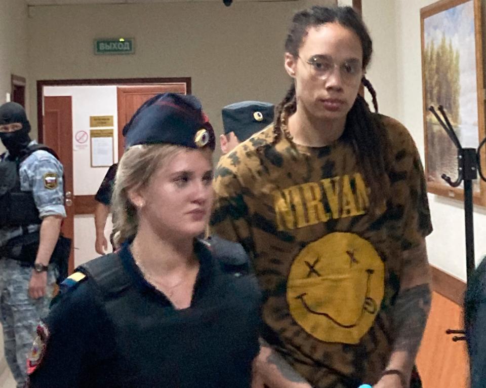 WNBA star and two-time Olympic gold medalist Brittney Griner is escorted to a courtroom for a hearing in the Khimki district court, just outside Moscow, Russia, Friday, July 15, 2022.