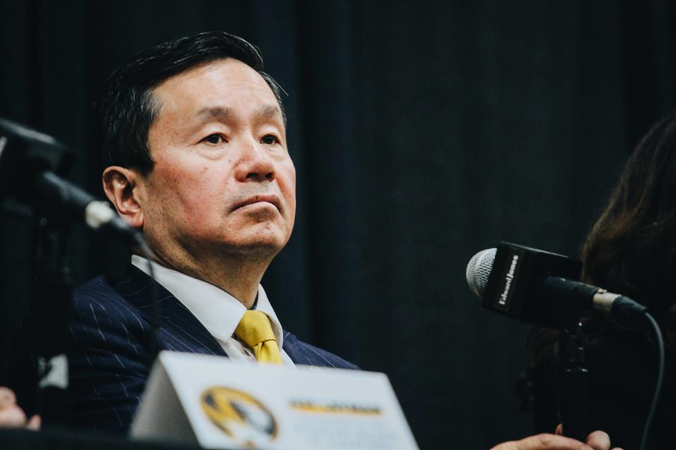 UM President Mun Choi stares out into the crowd during Dennis Gates' introductory press conference at Mizzou Arena in 2022.