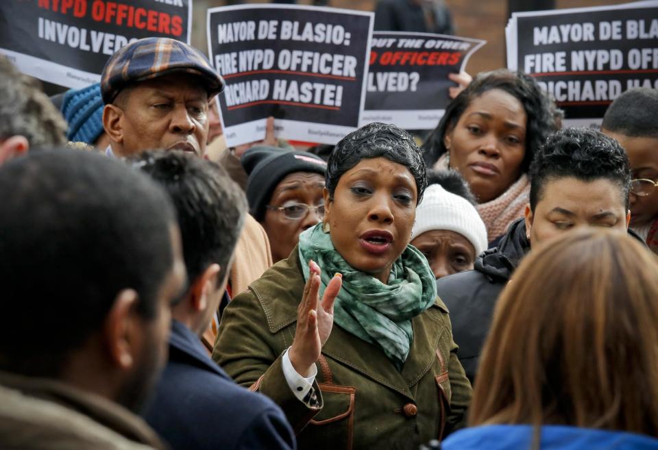 Political officials, civil rights activists and families of police shooting victims, join Constance Malcolm, center, mother of Ramarley Graham, and family members at a press conference outside police headquarters, Thursday Jan. 19, 2017, in New York. A disciplinary trial is underway for NYPD officer Richard Haste, who shot and killed the unarmed 18-year-old Graham in the bathroom of his New York City apartment. (AP Photo/Bebeto Matthews)