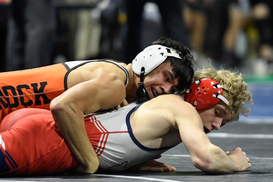 Caprock’s Nathaniel Ruiz tries to pin Northwest’s Wesley Hughes during the UIL State Wrestling Championship Friday, Feb. 18, 2022, in the Berry Center in Cypress, Texas. (Justin Rex/A-J Media)