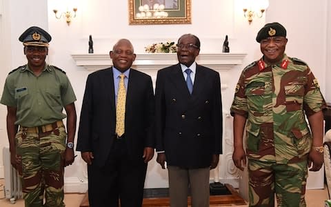 Mr Mugabe met Gen Constantino Chiwenga (R) on Thuesday - Credit: AFP/ZBC