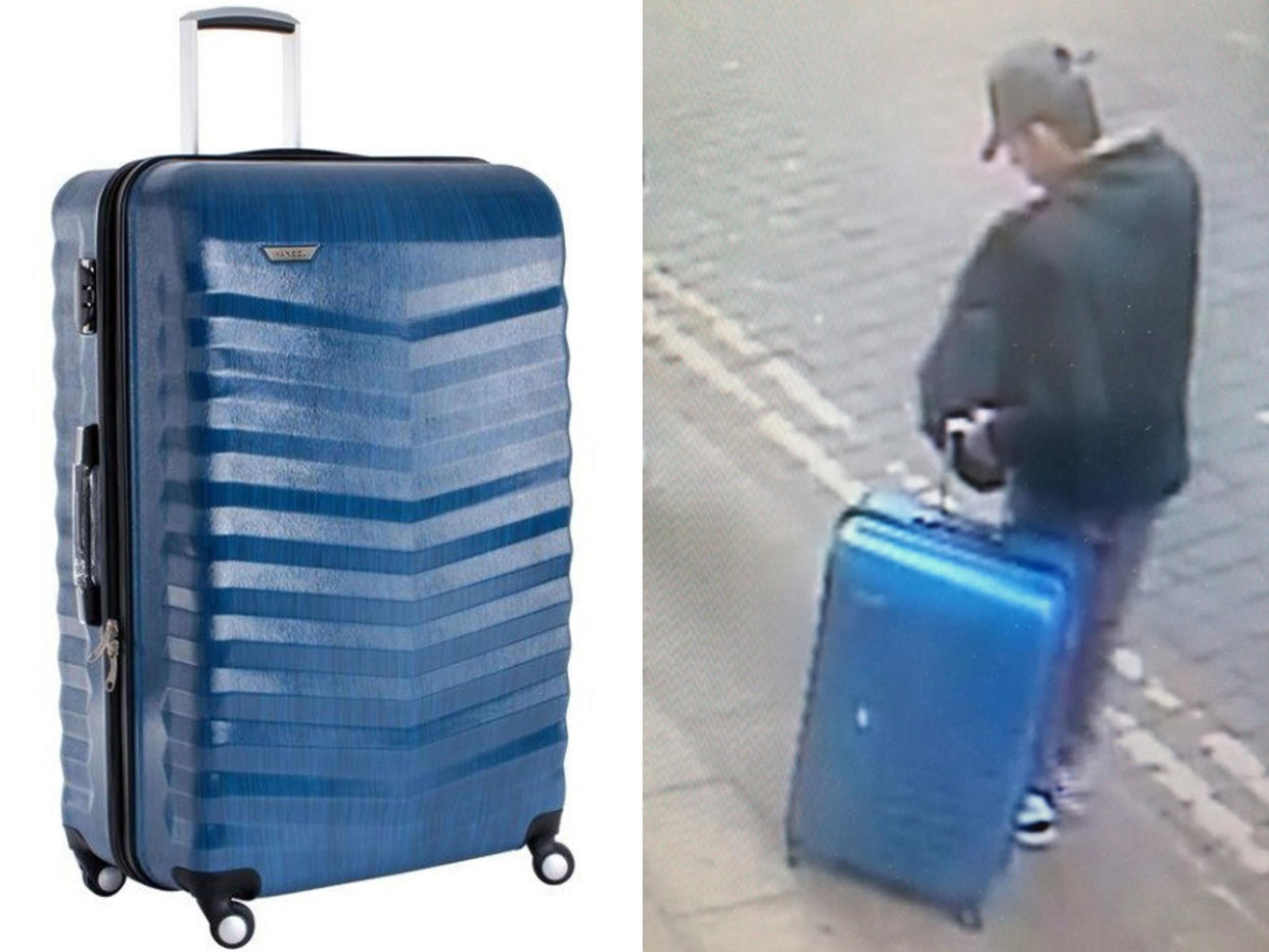 Police released an image of the bomber carrying a distinctive blue suitcase: AP