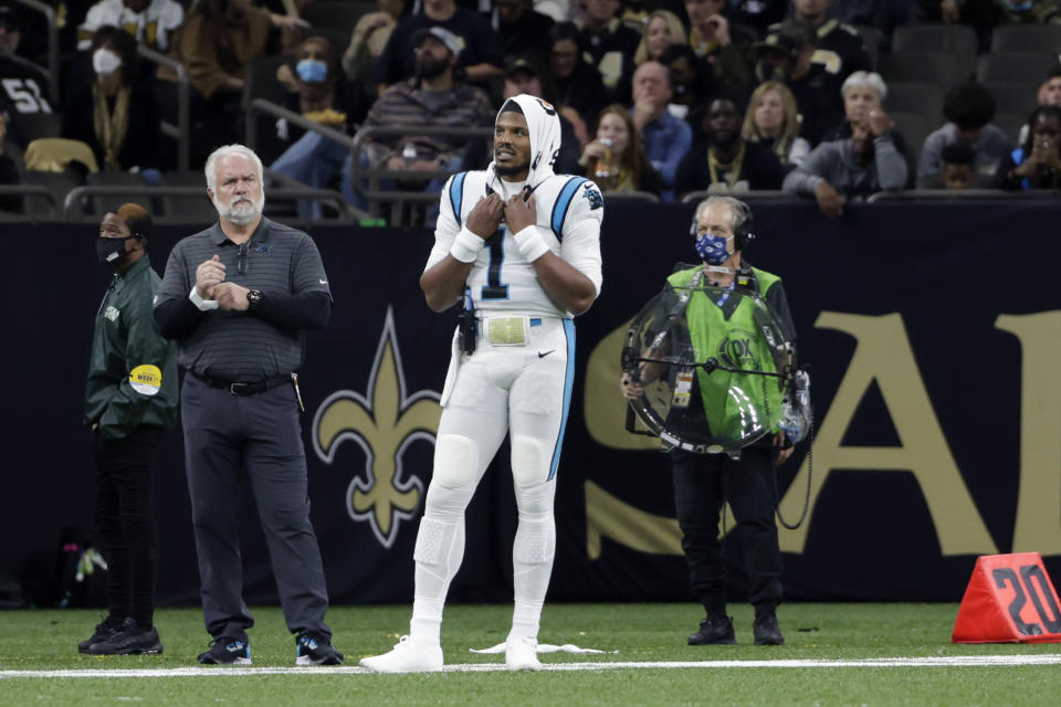 Carolina Panthers quarterback Cam Newton (1) stands on the sideline in the second half of an NFL football game against the New Orleans Saints in New Orleans, Sunday, Jan. 2, 2022. (AP Photo/Derick Hingle)