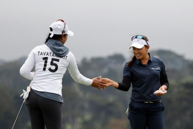 Thailand's Patty Tavatanakit and Atthaya Thitikul celebrate on the final day of round-robin play at the LPGA International Crown team event
