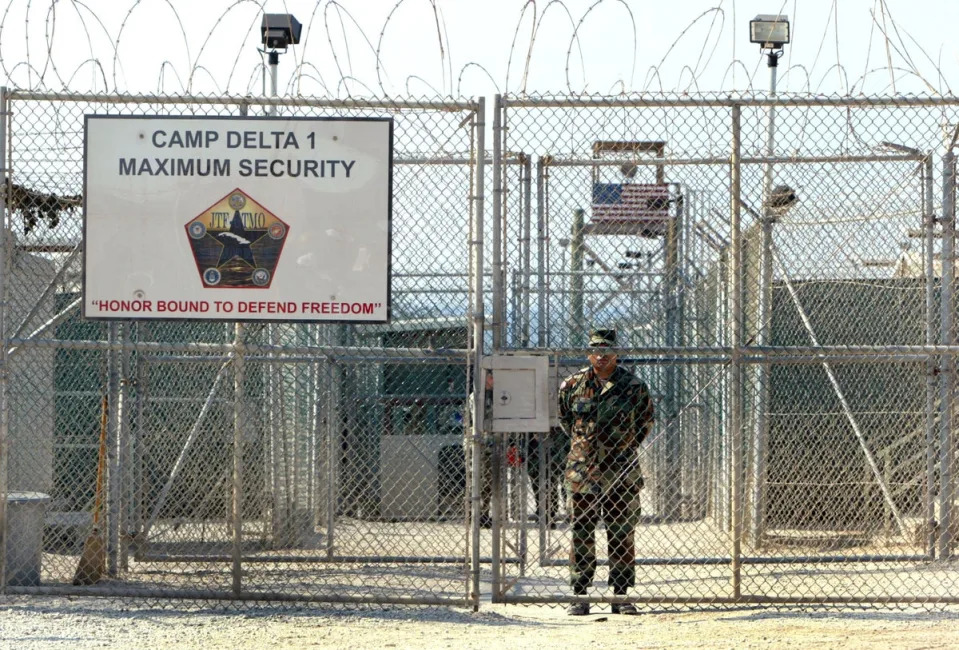 A U.S. Army soldier stands at the entrance to Camp Delta where detainees from the U.S. war in Afghanistan live April 7, 2004 in Guantanamo Bay, Cuba (Getty Images)