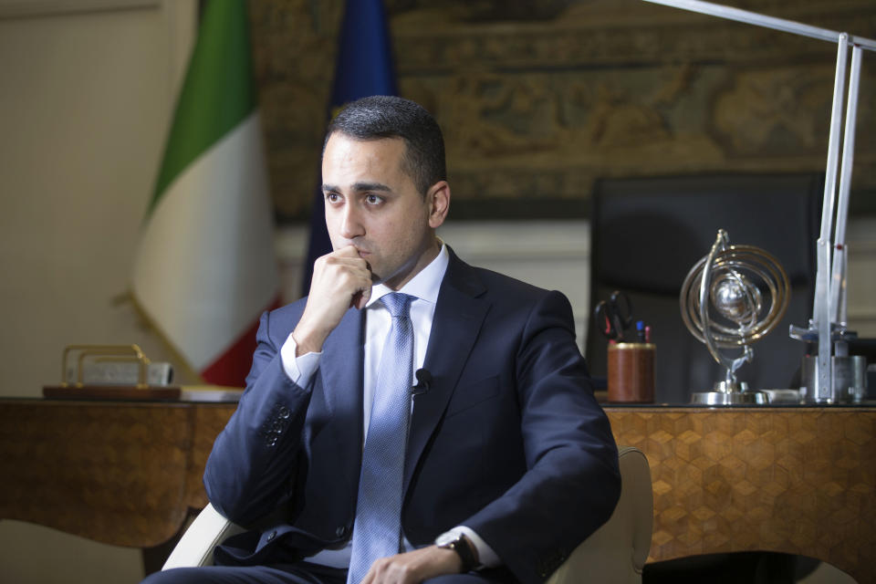 Italian Foreign Minister Luigi Di Maio listens to questions during an interview with The Associated Press in his studio in Rome, Tuesday, Feb. 4, 2019. Di Maio says there is no risk his country will leave the European Union but is calling for reforms to give more weight to European lawmakers since they are directly elected by citizens. (AP Photo/Domenico Stinellis)