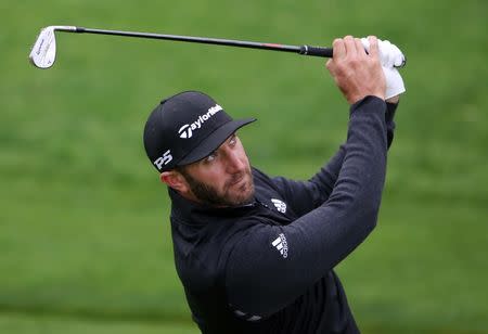 May 14, 2019; Farmingdale, NY, USA; Dustin Johnson looks over the third green during a practice round for the PGA Championship golf tournament at Bethpage State Park - Black Course. Mandatory Credit: Peter Casey-USA TODAY Sports