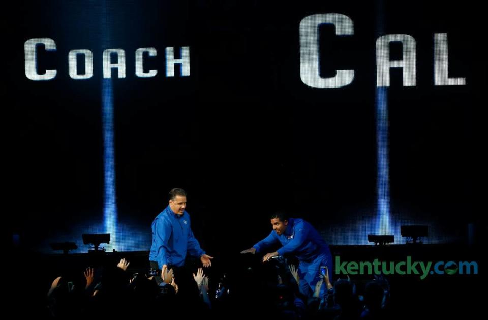 Recording artist Drake, right, bows to Kentucky Wildcats head coach John Calipari during Big Blue Madness Rupp Arena Friday, Oct. 17, 2014. Herald-Leader