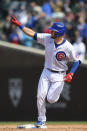 Chicago Cubs' David Bote celebrates while rounding second base after hitting a three-run home run during the fifth inning of a baseball game against the Atlanta Braves Saturday, April 17, 2021, in Chicago. (AP Photo/Paul Beaty)