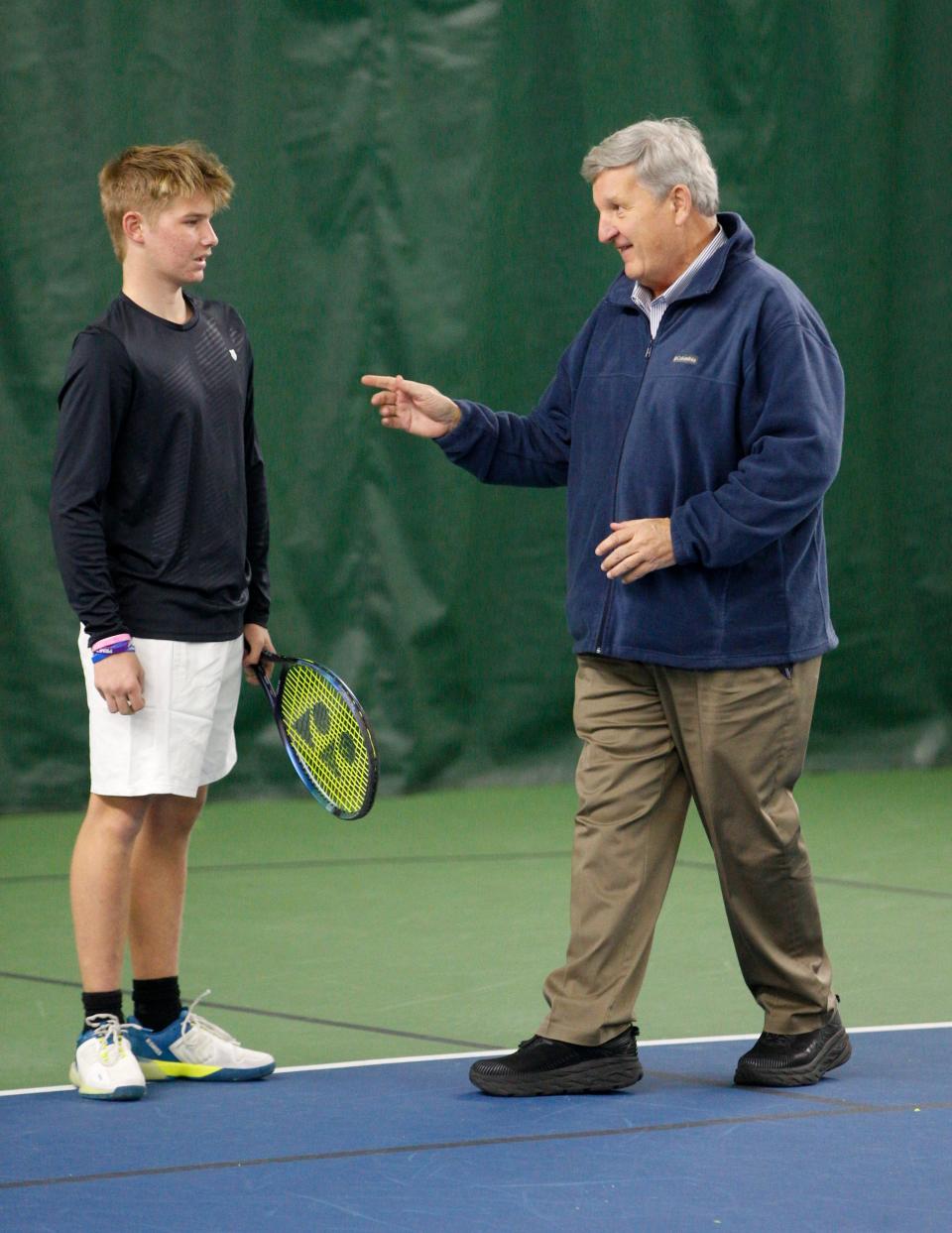 David Filer speaks with his friend, Dan Bigg, at right, at a practice session Monday, Jan. 16, 2023, at the South Bend Racquet Club.