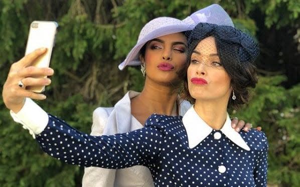 Priyanka Chopra (left) taking a selfie at the royal wedding with Suits actress Abigail Spencer - Priyanka Chopra/Instagram