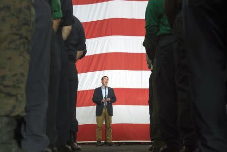 U.S. Secretary of Defense Ash Carter speaks with U.S. service members aboard the USS Theodore Roosevelt aircraft carrier in the South China Sea, in this handout photograph taken and released on November 5, 2015. REUTERS/Senior Master Sgt. Adrian Cadiz/Department of Defense/Handout