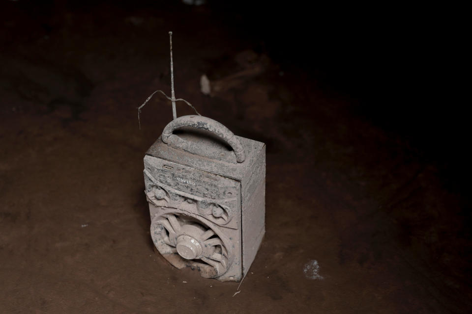 <p>A radio covered with ash is seen after the eruption of the Fuego volcano at San Miguel Los Lotes in Escuintla, Guatemala, June 8, 2018. (Photo: Carlos Jasso/Reuters) </p>