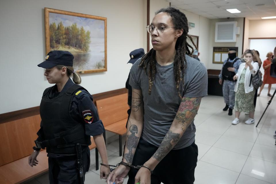 WNBA star and two-time Olympic gold medalist Brittney Griner is escorted from a courtroom after her last words, in Khimki just outside Moscow, Russia, Thursday, Aug. 4, 2022. Closing arguments in Brittney Griner's cannabis possession case are set for Thursday, nearly six months after the American basketball star was arrested at a Moscow airport in a case that reached the highest levels of US-Russia diplomacy.