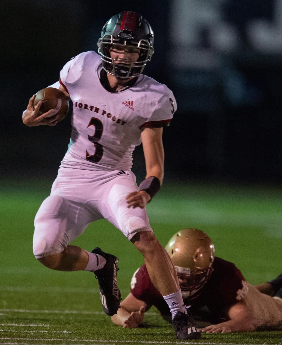 North Posey’s Liam Stone escapes from Mater Dei's Clay Martin (52) as the North Posey Vikings play the Mater Dei Wildcats at the Reitz Bowl in Evansville, Ind., Friday evening, Nov. 4, 2022.