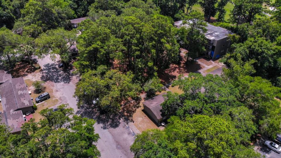 A drone photo shows an overall view of Chimney Cove Apartments within a canopy of trees as seen on May 25, 2023 on Hilton Head Island