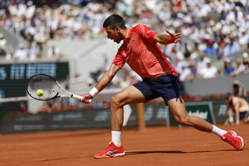 Serbia's Novak Djokovic plays a shot against Russia's Karen Khachanov during their quarter final match of the French Open tennis tournament at the Roland Garros stadium in Paris, Tuesday, June 6, 2023. (AP Photo/Jean-Francois Badias)