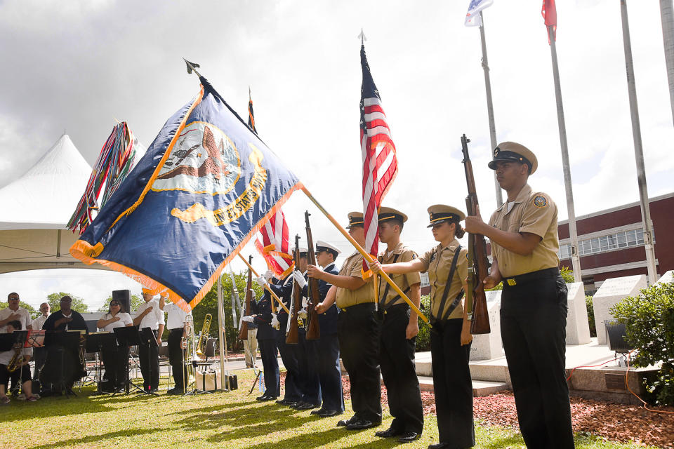 <p>The color guard from the U.S. Coast Guard SFO Fort Macon; Seaman Murphy, Petty Officer 2nd Class Hussey, Petty Officer 2nd Class Narvaez and Petty Officer 3rd Class Frazer; and Navy Junior ROTC from West Carteret High School; William Johnson, Tyberius Tooley, Ashley Scholer and Hunter Lopez present the colors at the Carteret County Memorial Day Service in Beaufort, N.C., on Saturday, May 28, 2016. (Elizabeth Horn/The Daily News via AP) </p>