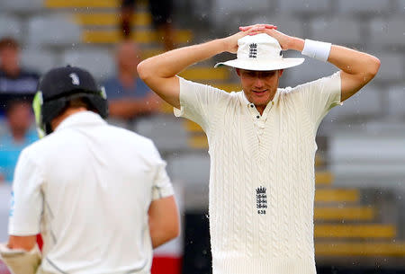 Cricket - Test Match - New Zealand v England - Eden Park, Auckland, New Zealand, March 24, 2018. England's Stuart Broad reacts after New Zealand's Bradley-John Watling was nearly run out during the third day of the first cricket test match. REUTERS/David Gray