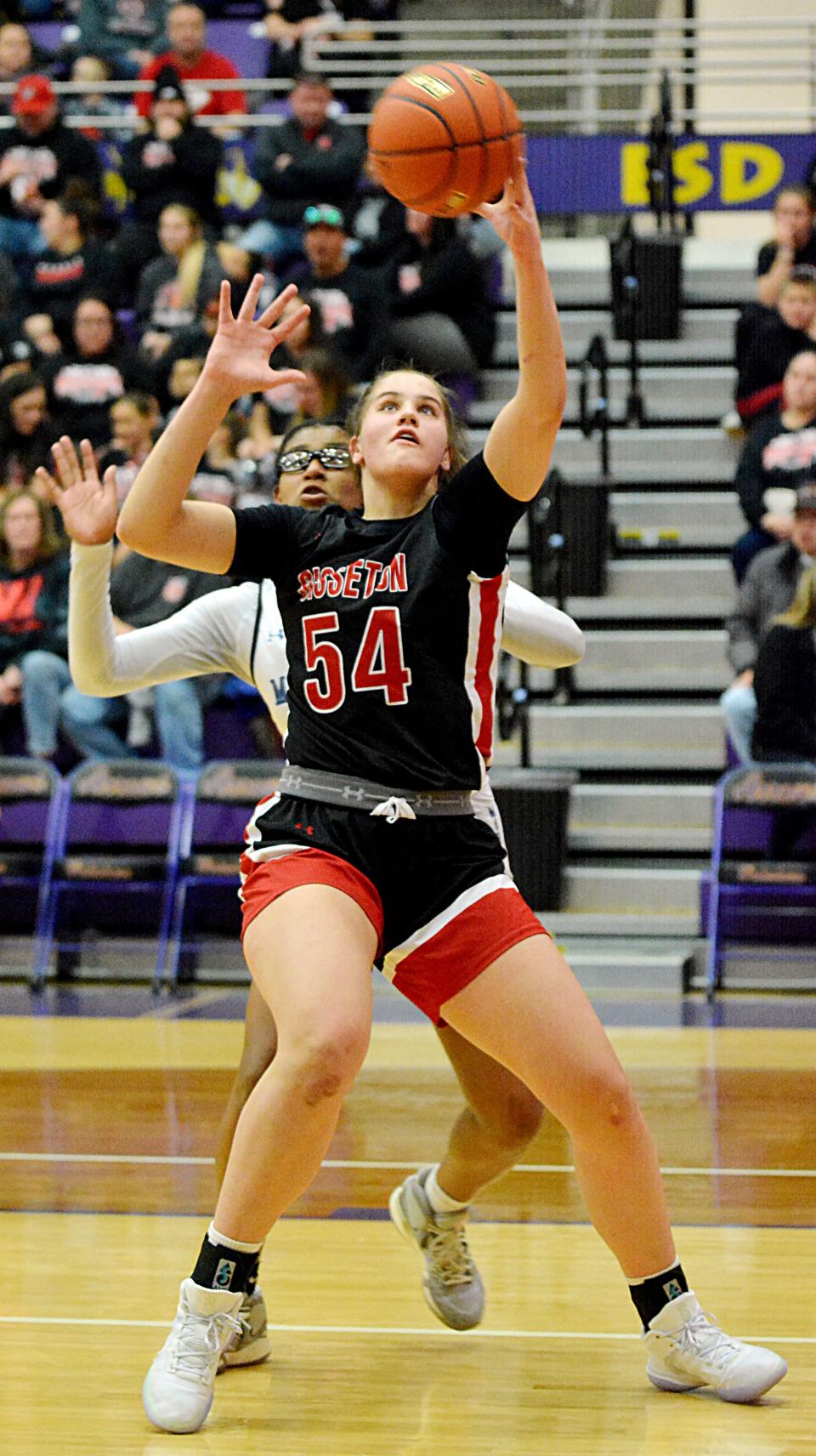 Sisseton's Krista Langager hauls in a pass against Red Cloud's Anjah Lamont during the third-place game of the state Class A girls basketball tournament on Saturday, March 11, 2023 in the Watertown Civic Arena.