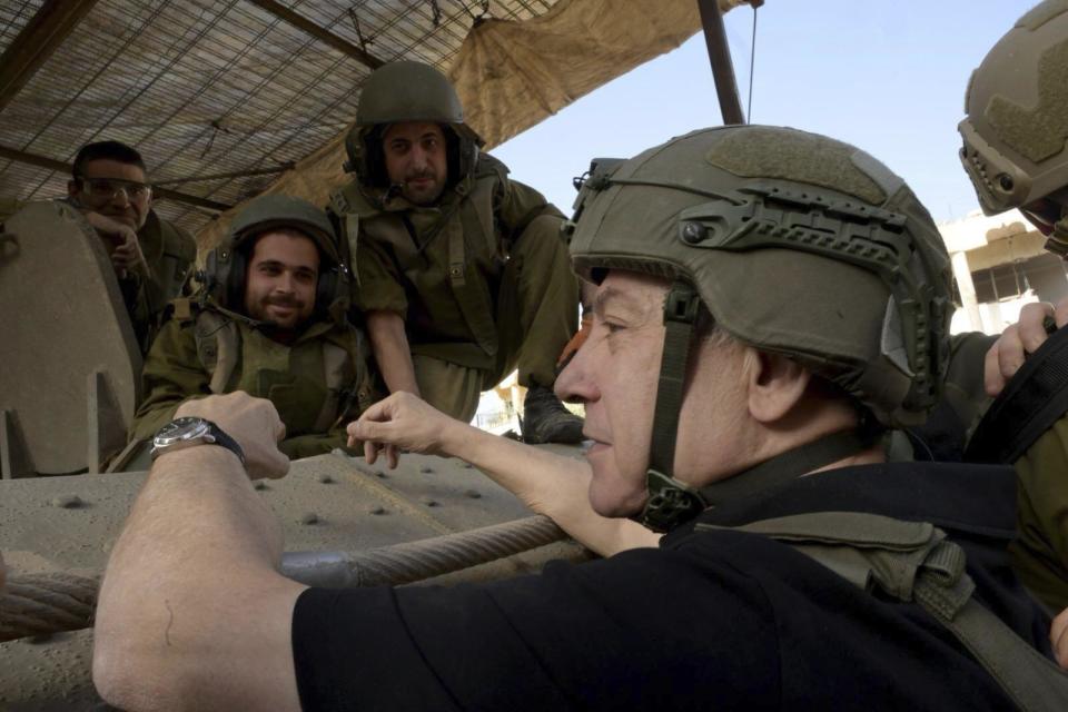 Israel's Prime Minister Benjamin Netanyahu visits the Gaza Strip, where he received security briefings with commanders and soldiers and visited one of the tunnels that has been revealed, on Sunday Nov. 26, 2023. (Avi Ohayon/GPO/Handout via AP)