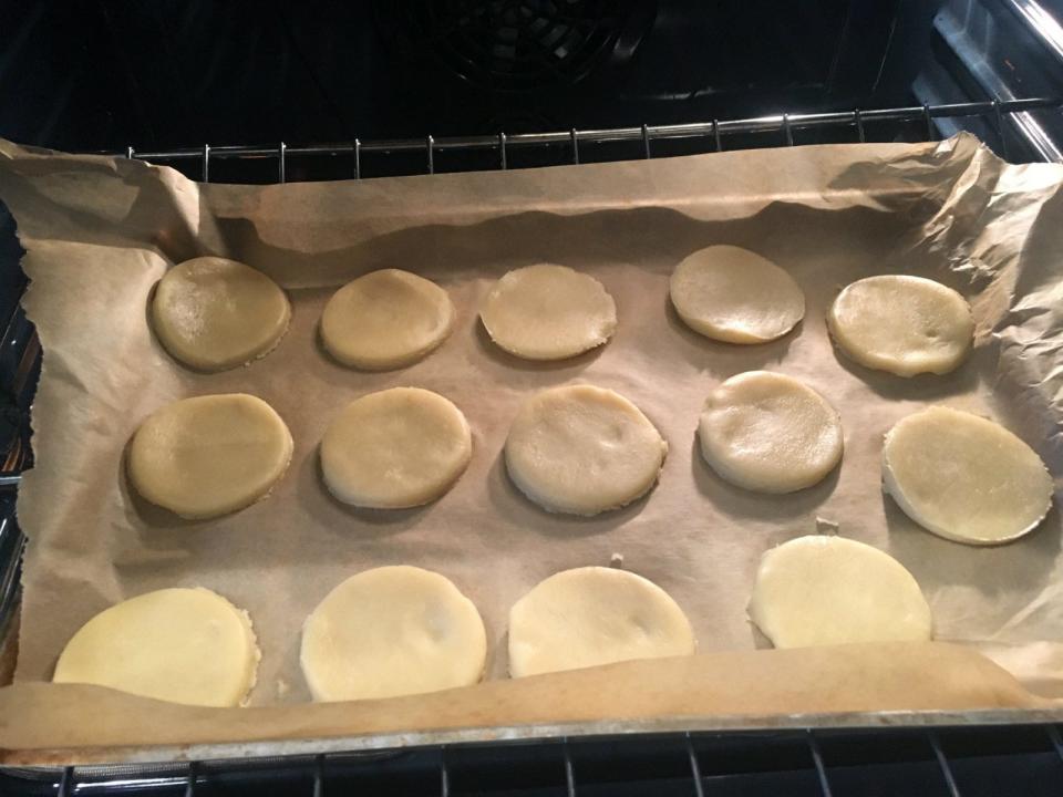 After struggling with the dry dough, I used my cookie cutter (a.k.a. the bottom of a water glass) to cut out oven-ready cookies.