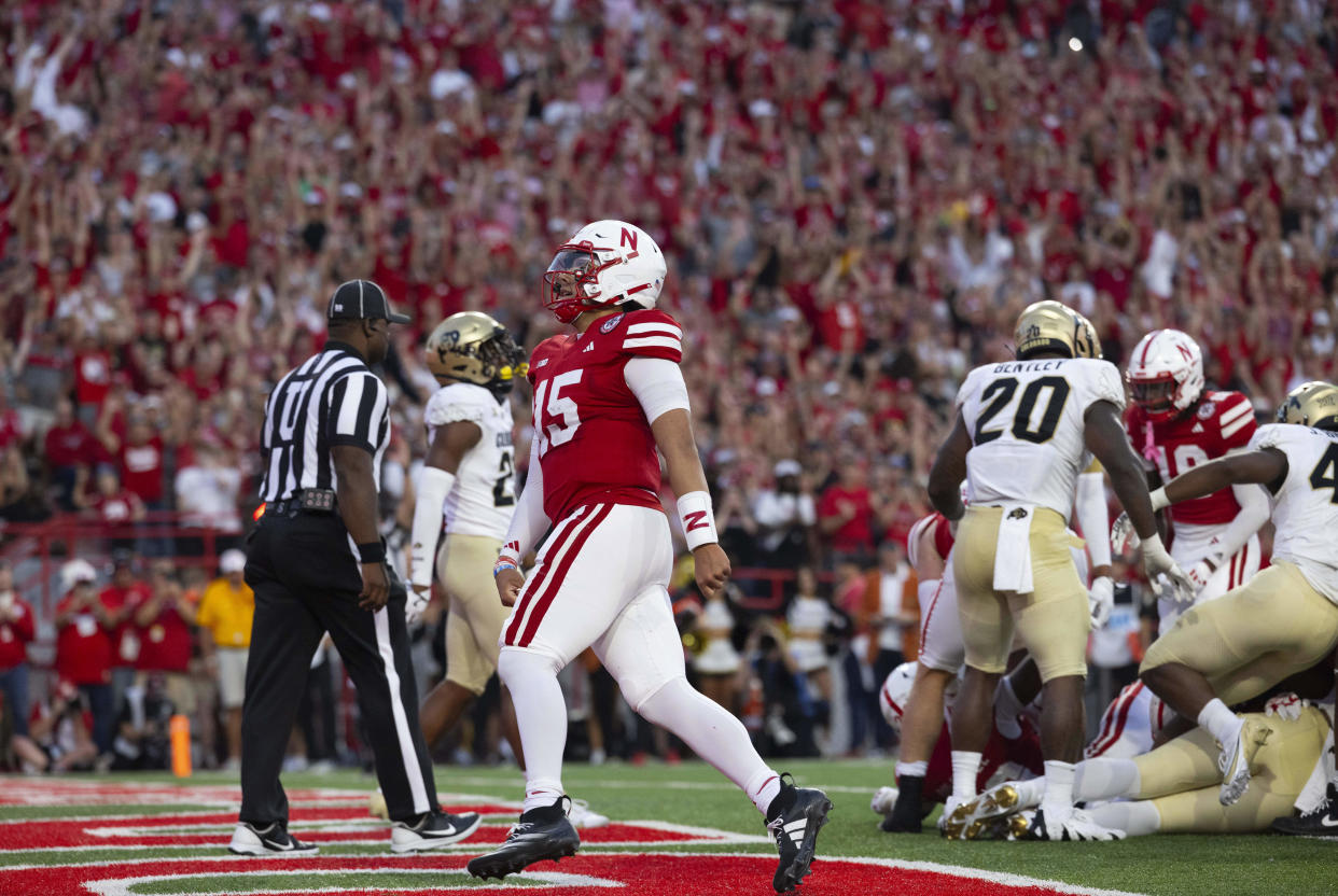 Nebraska quarterback Dylan Raiola (15) celebrates following a touchdown by Dante Dowdell, not pictured, during the first half of an NCAA college football game against Colorado, Saturday, Sept. 7, 2024, in Lincoln, Neb. (AP Photo/Rebecca S. Gratz)