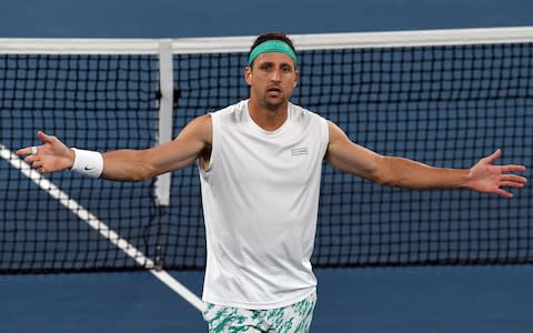 Tennys Sandgren of the US celebrates after a victory against Italy's Fabio Fognini during their men's singles match on day seven of the Australian Open tennis tournament in Melbourne