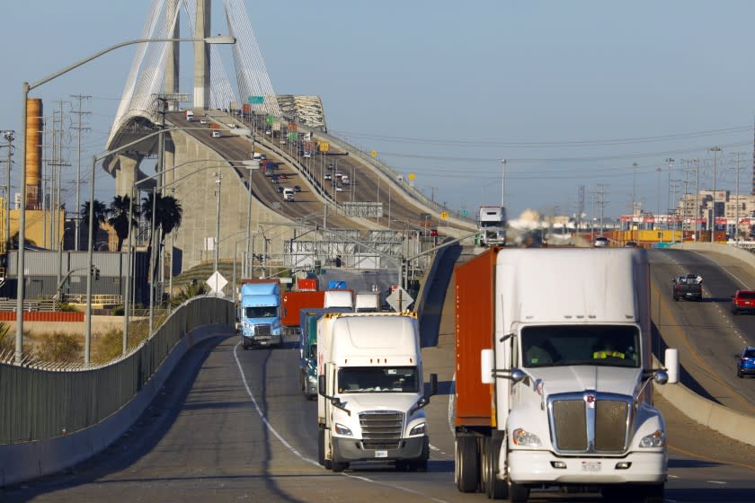Wilmington, California-July 30, 2021-Trucks move across Terminal Island on CA-47 through the Port of Los Angeles and Port of Long Beach. The vast majority of trucks moving in and out of the two ports are diesel. (Carolyn Cole / Los Angeles Times)