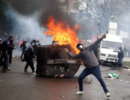 A protester hurls rocks at the police during clashes outside the Congress, where the budget bill is being debated, in Buenos Aires, Argentina October 24, 2018. REUTERS/Martin Acosta