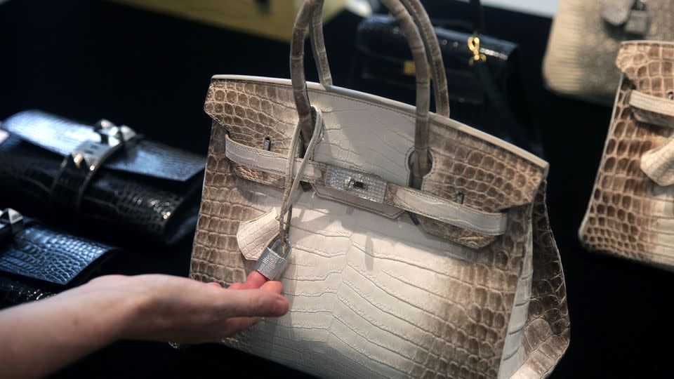 The "Diamond Himalaya" Birkin — which set records last year as the most expensive handbag to sell at auction — features crocodile skin, 18K gold and diamond hardware. - Isaac Lawrence/AFP/Getty Images