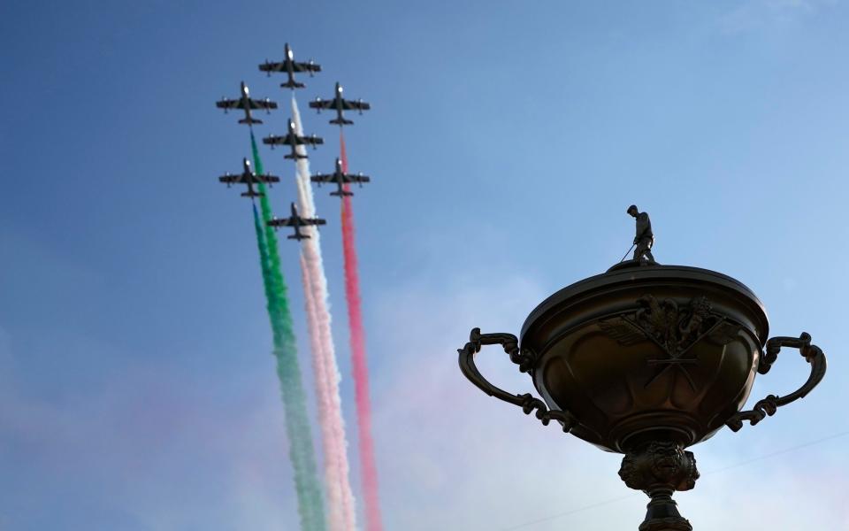 A fly-past by the Italian Air Force team leave smoke the color of the Italian flag