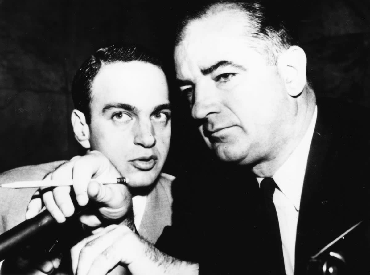 Attorney Roy Cohn, left, talking to American senator Joseph McCarthy, circa 1954 (Getty Images)