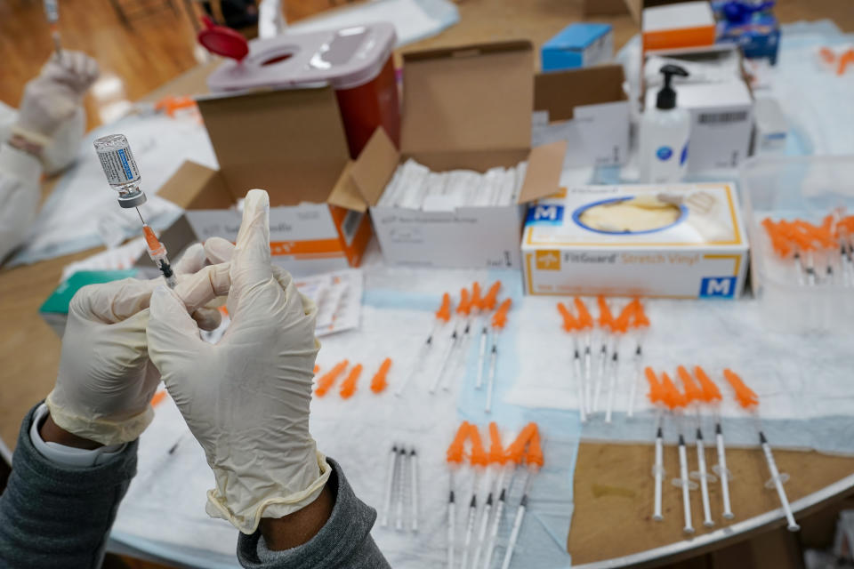 FILE - In this April 8, 2021, file photo, a Northwell Health registered nurses fills a syringe with the Johnson & Johnson COVID-19 vaccine at a pop up vaccination site at the Albanian Islamic Cultural Center in the Staten Island borough of New York. The Biden administration on Wednesday, May 5, joined calls for more sharing of the technology behind COVID-19 vaccines to help speed the end of the pandemic, a shift that puts the U.S. alongside many in the developing world who want rich countries to do more to get doses to the needy. (AP Photo/Mary Altaffer, File)