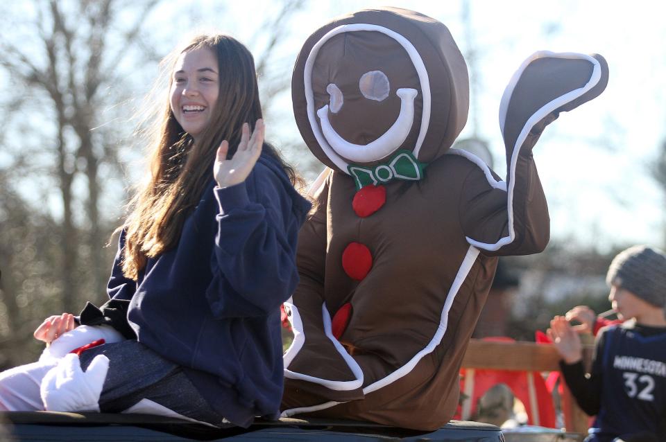 A gingerbread man waves to the crowd at the White House Christmas parade on Saturday, December 5, 2020.
